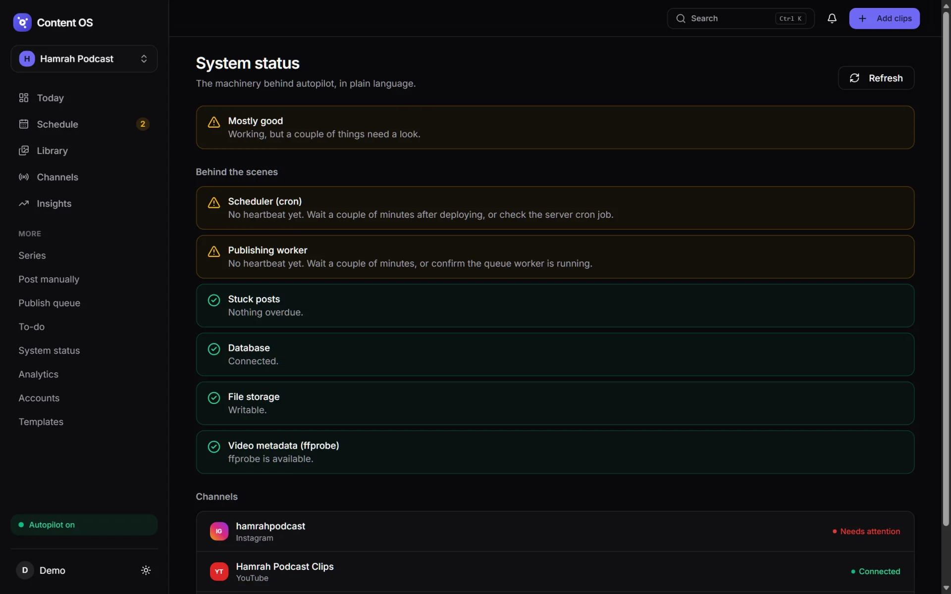 Content OS System status page: overall Mostly good, with scheduler and worker heartbeat warnings and green checks for stuck posts, database, storage and ffprobe.